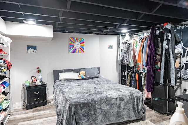 bedroom with wood-type flooring