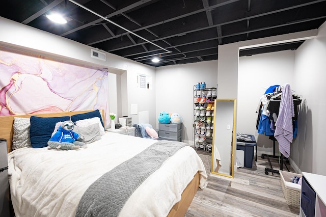 bedroom featuring wood-type flooring