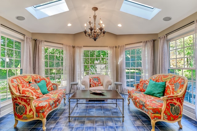 sunroom with a healthy amount of sunlight, lofted ceiling with skylight, and an inviting chandelier