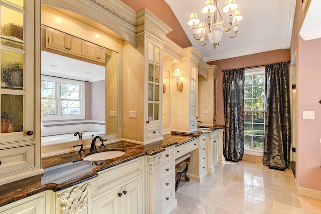 bathroom featuring vanity, an inviting chandelier, a washtub, tile floors, and ornamental molding