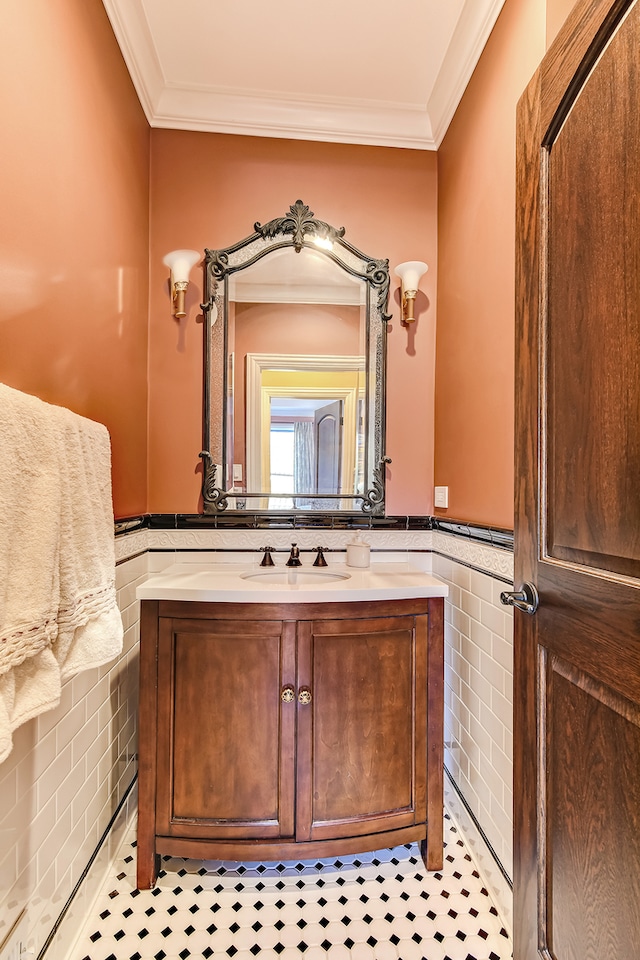 bathroom featuring ornamental molding, vanity, tile floors, and tile walls