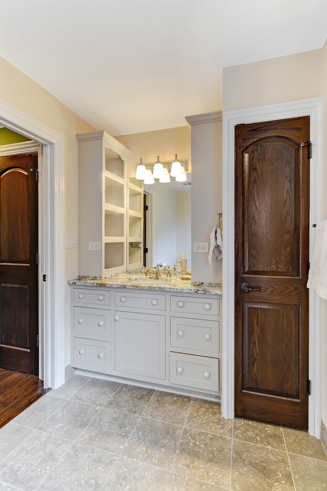 bathroom featuring vanity and tile floors