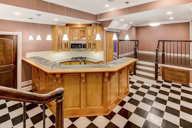 kitchen with ornamental molding, a breakfast bar, light tile flooring, and pendant lighting