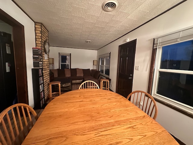 dining area featuring a textured ceiling