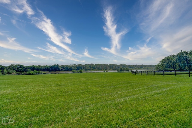 view of yard with a rural view