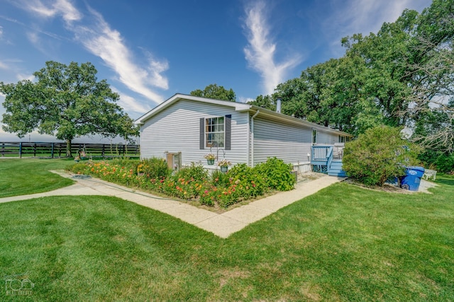 view of property exterior featuring a yard