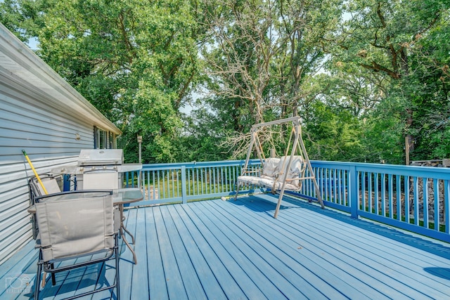 wooden deck featuring grilling area