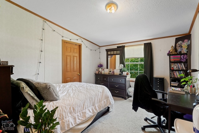 carpeted bedroom featuring ornamental molding and a textured ceiling