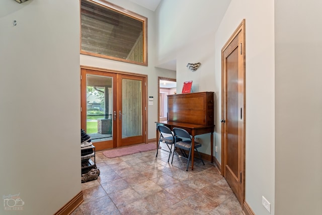 home office with light tile floors and french doors