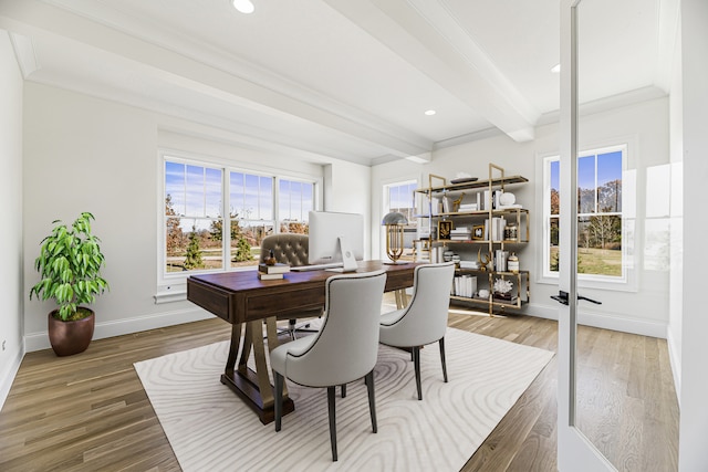 home office with hardwood / wood-style floors, beam ceiling, and ornamental molding