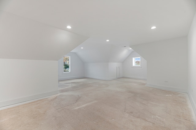 additional living space with vaulted ceiling