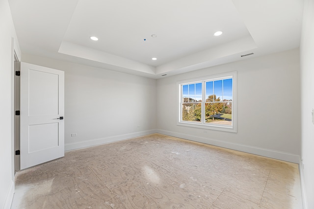 empty room with a tray ceiling