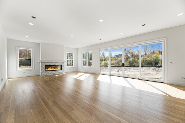 unfurnished living room with light hardwood / wood-style floors