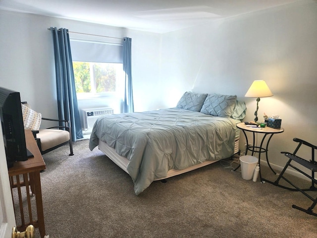bedroom with carpet floors and a wall unit AC