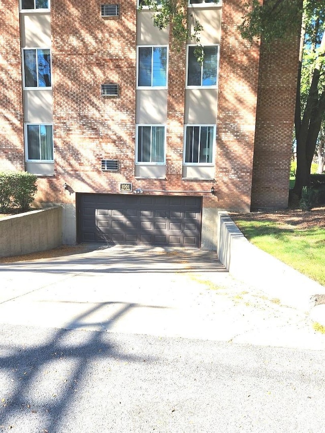 garage featuring driveway