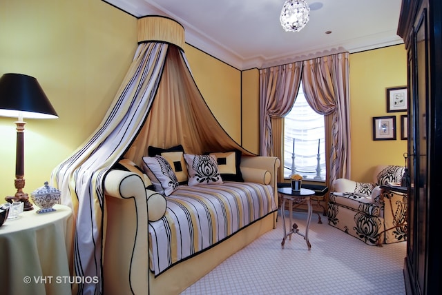 carpeted bedroom featuring crown molding