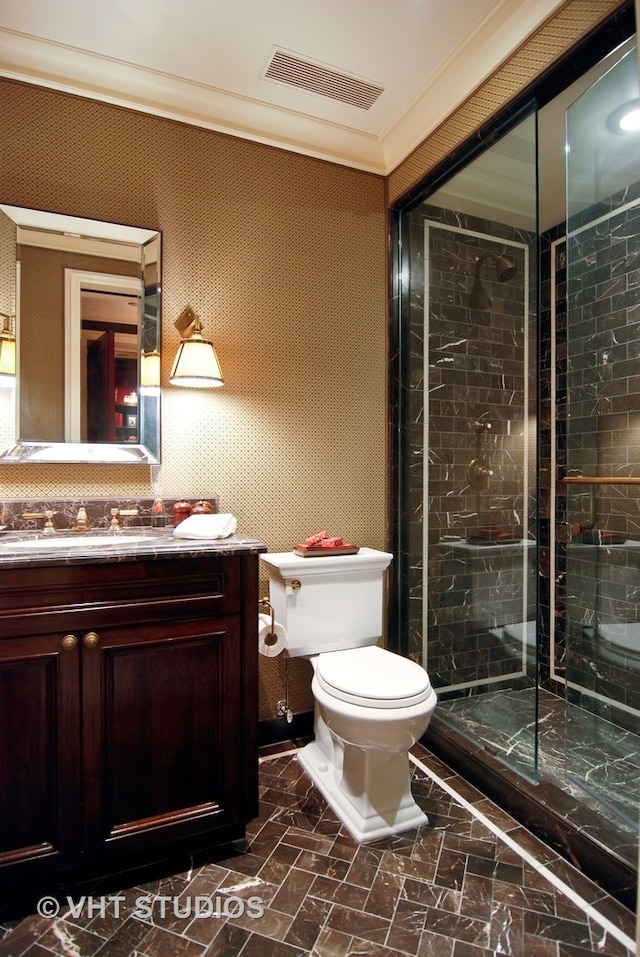 bathroom featuring walk in shower, oversized vanity, toilet, and ornamental molding