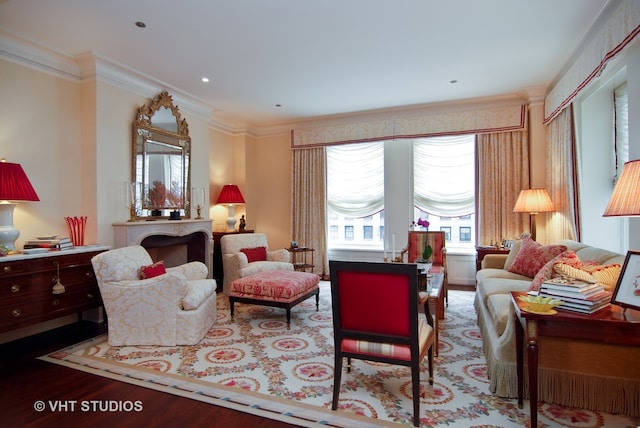 living room featuring ornamental molding and hardwood / wood-style floors