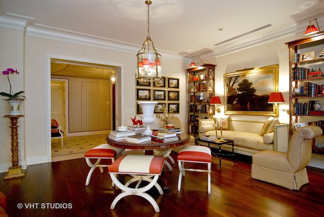 dining area with an inviting chandelier, ornamental molding, and dark wood-type flooring