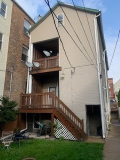 back of property with a balcony