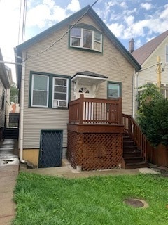 back of property with a wooden deck