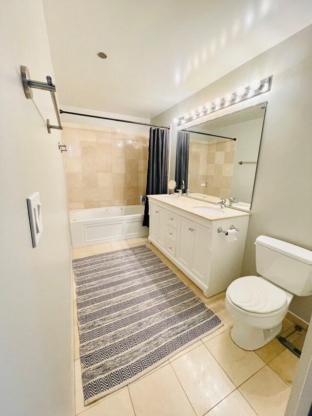 full bathroom featuring toilet, shower / tub combo, vanity, and tile flooring