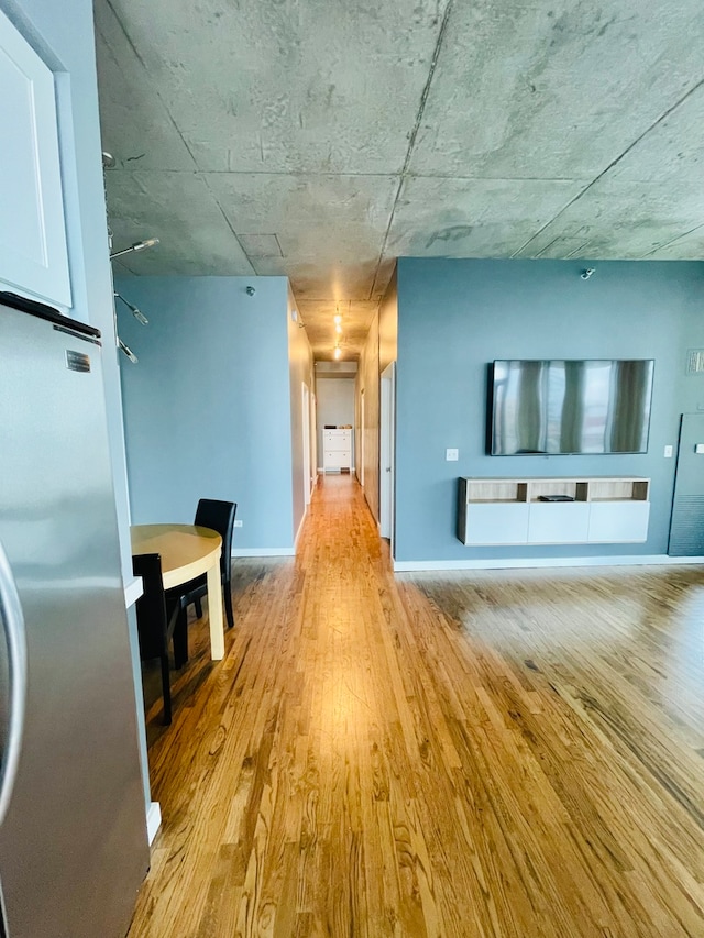 unfurnished living room featuring light wood-type flooring