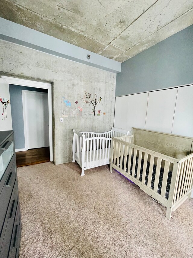 bedroom featuring light carpet