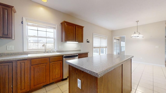 kitchen with decorative light fixtures, a center island, dishwasher, sink, and light tile flooring