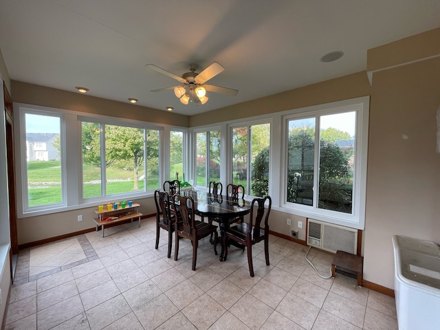 dining room with light tile flooring, ceiling fan, and a wealth of natural light