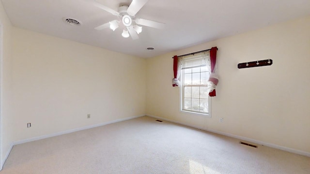 carpeted empty room with ceiling fan