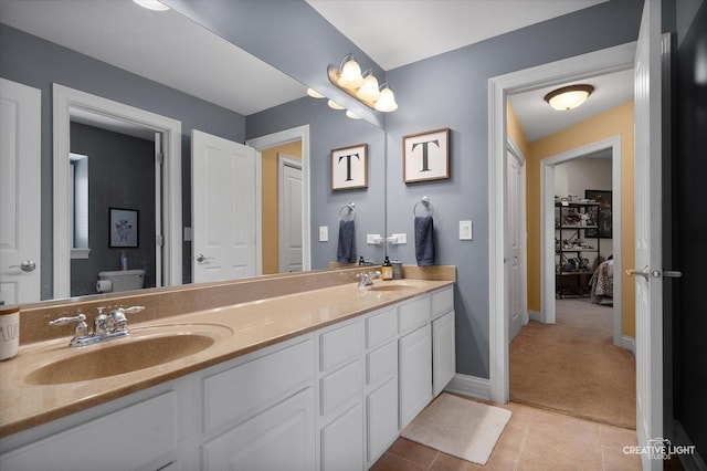 5085 Half Round Rd, Oswego, IL 60543 - full bath featuring double vanity, toilet, baseboards, and tile patterned flooring