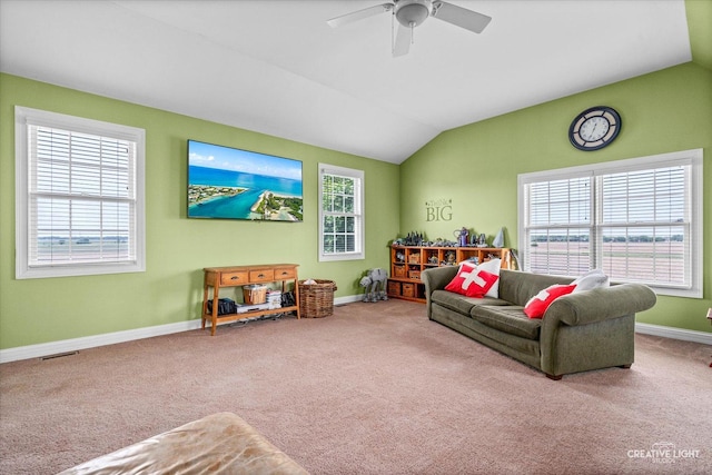 5085 Half Round Rd, Oswego, IL 60543 - carpeted living room featuring ceiling fan, lofted ceiling, healthy amount of natural light, and baseboards