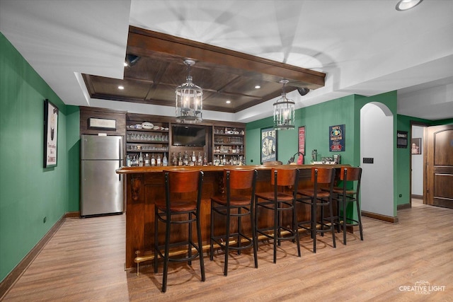 5085 Half Round Rd, Oswego, IL 60543 - community bar area with freestanding refrigerator, arched walkways, light wood-style flooring, coffered ceiling, and baseboards