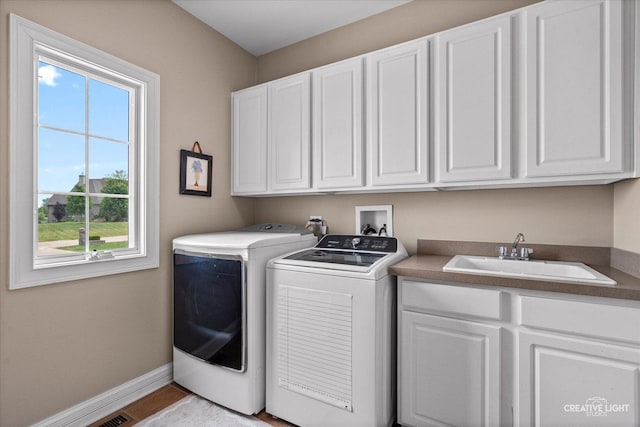 5085 Half Round Rd, Oswego, IL 60543 - washroom with cabinet space, independent washer and dryer, and baseboards