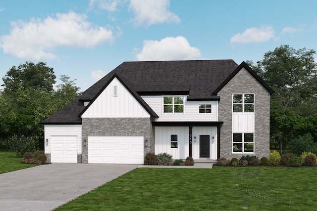 view of front of property featuring a front yard and a garage