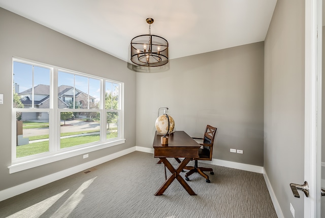 office space with dark carpet and an inviting chandelier