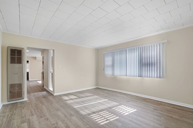 spare room featuring light hardwood / wood-style flooring