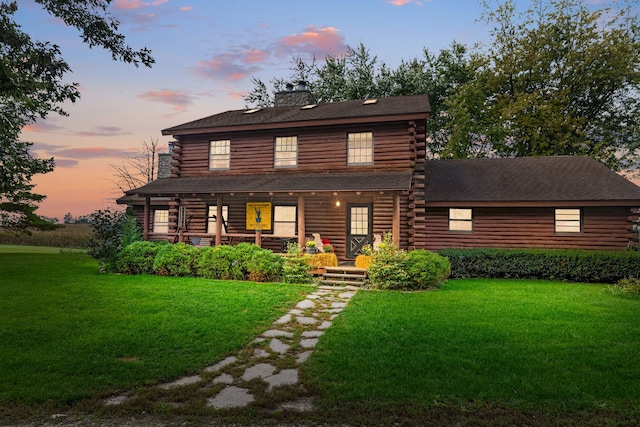 29650 N Garland Rd, Wauconda, IL 60084 - cabin featuring covered porch, log siding, and a front yard