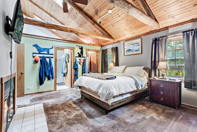 bedroom with dark tile floors, ceiling fan, wood ceiling, beamed ceiling, and high vaulted ceiling