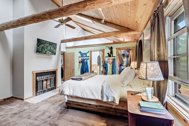 bedroom featuring ceiling fan, multiple windows, high vaulted ceiling, and beamed ceiling