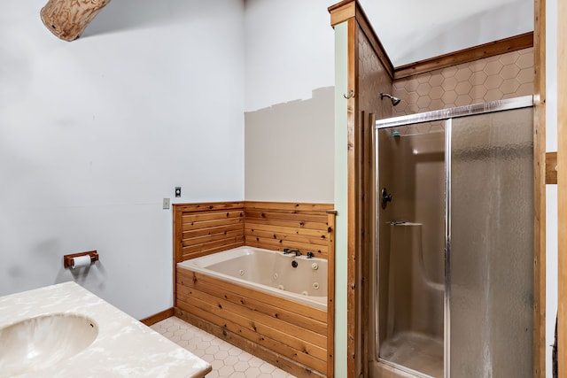 bathroom with tile flooring, plus walk in shower, and vanity