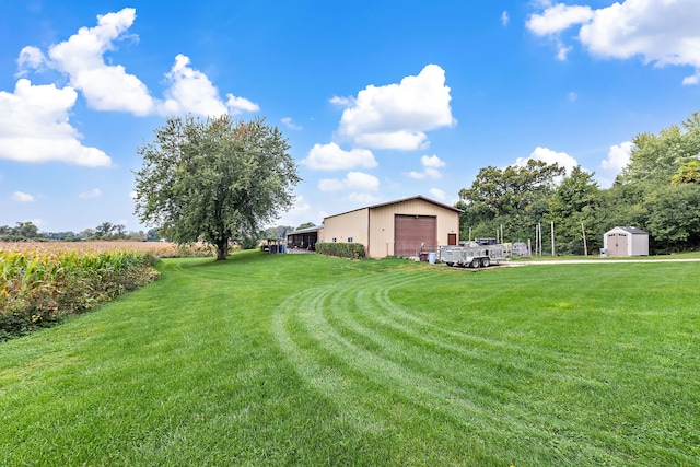 view of yard featuring a shed and a garage