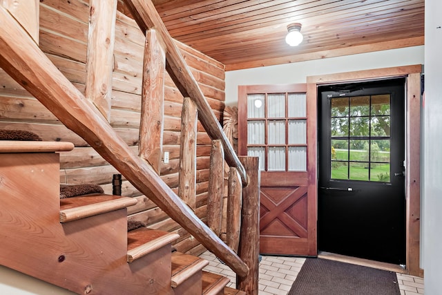 interior space featuring wood ceiling and rustic walls