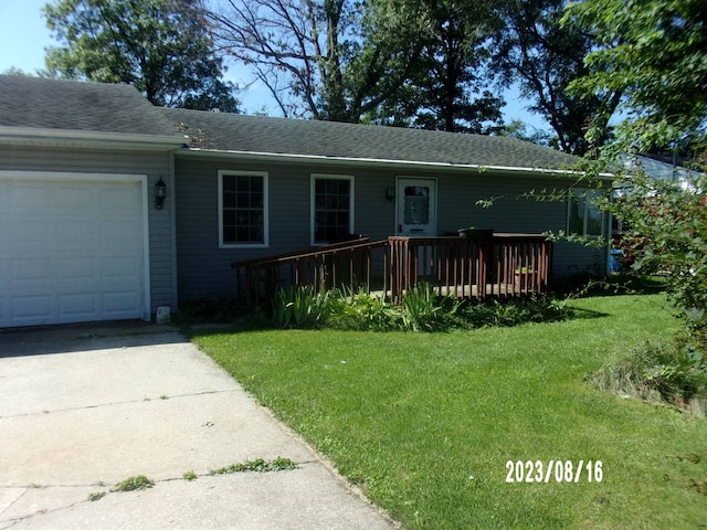 650 W Blue St, Sheldon, IL 60966 - view of front of home with a wooden deck, a front lawn, and a garage