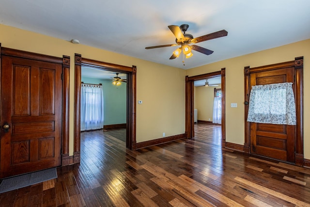616 N Pleasant St, Princeton, IL 61356 - foyer entrance featuring a ceiling fan, dark wood-type flooring, and baseboards