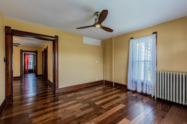 616 N Pleasant St, Princeton, IL 61356 - empty room with radiator heating unit, hardwood / wood-style flooring, ceiling fan, and baseboards