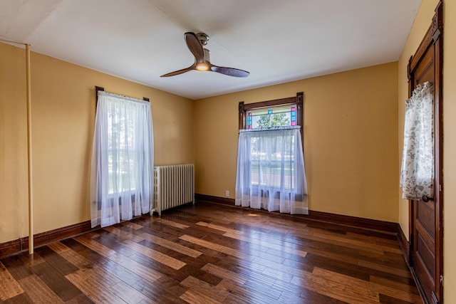 616 N Pleasant St, Princeton, IL 61356 - unfurnished room featuring radiator, wood-type flooring, ceiling fan, and baseboards