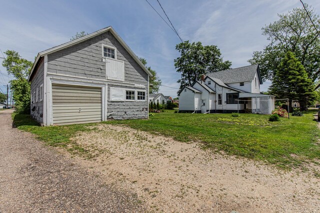 616 N Pleasant St, Princeton, IL 61356 - view of home's exterior featuring a detached garage and driveway