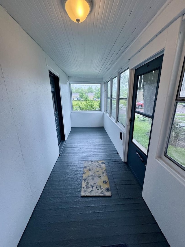 616 N Pleasant St, Princeton, IL 61356 - unfurnished sunroom featuring wooden ceiling, hardwood / wood-style floors, and a textured wall
